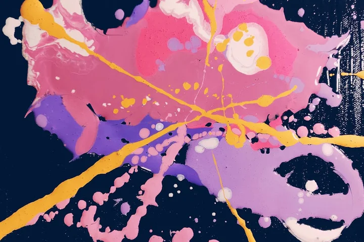 Abstract paint-splatter artwork in pink, purple, and yellow on a dark background, evoking the drying stage after stain removal.