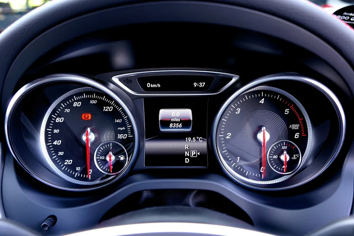 Close-up view of a modern car dashboard showing the instrument cluster with digital display.
