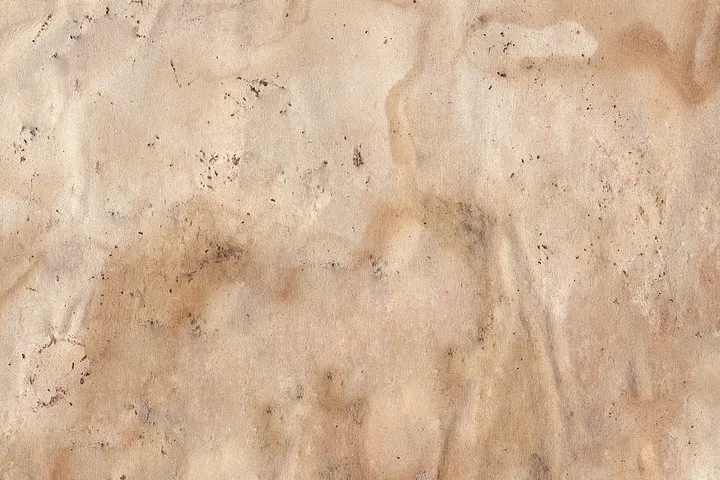 Ceiling with visible brown water stains and beige discoloration.