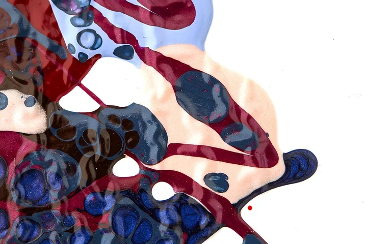 Abstract artwork resembling red and blue liquid stains, symbolizing DIY stain remover experiments.