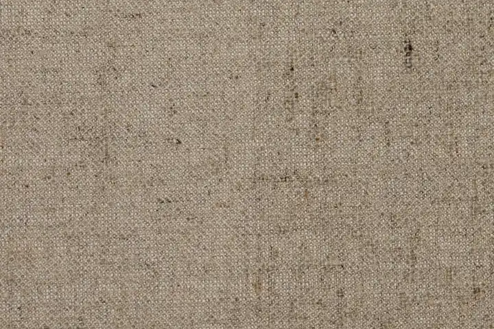 Close-up of beige woven fabric texture
