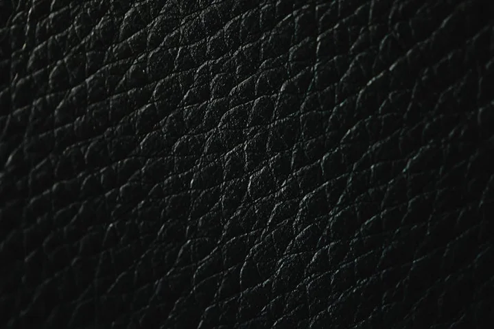 Close-up of black leather upholstery texture