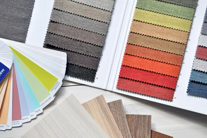 Color swatches and fabric samples spread on a surface